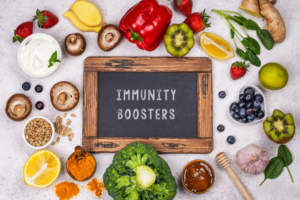 Immunity Boosters sign surrounded by fruits and vegetables